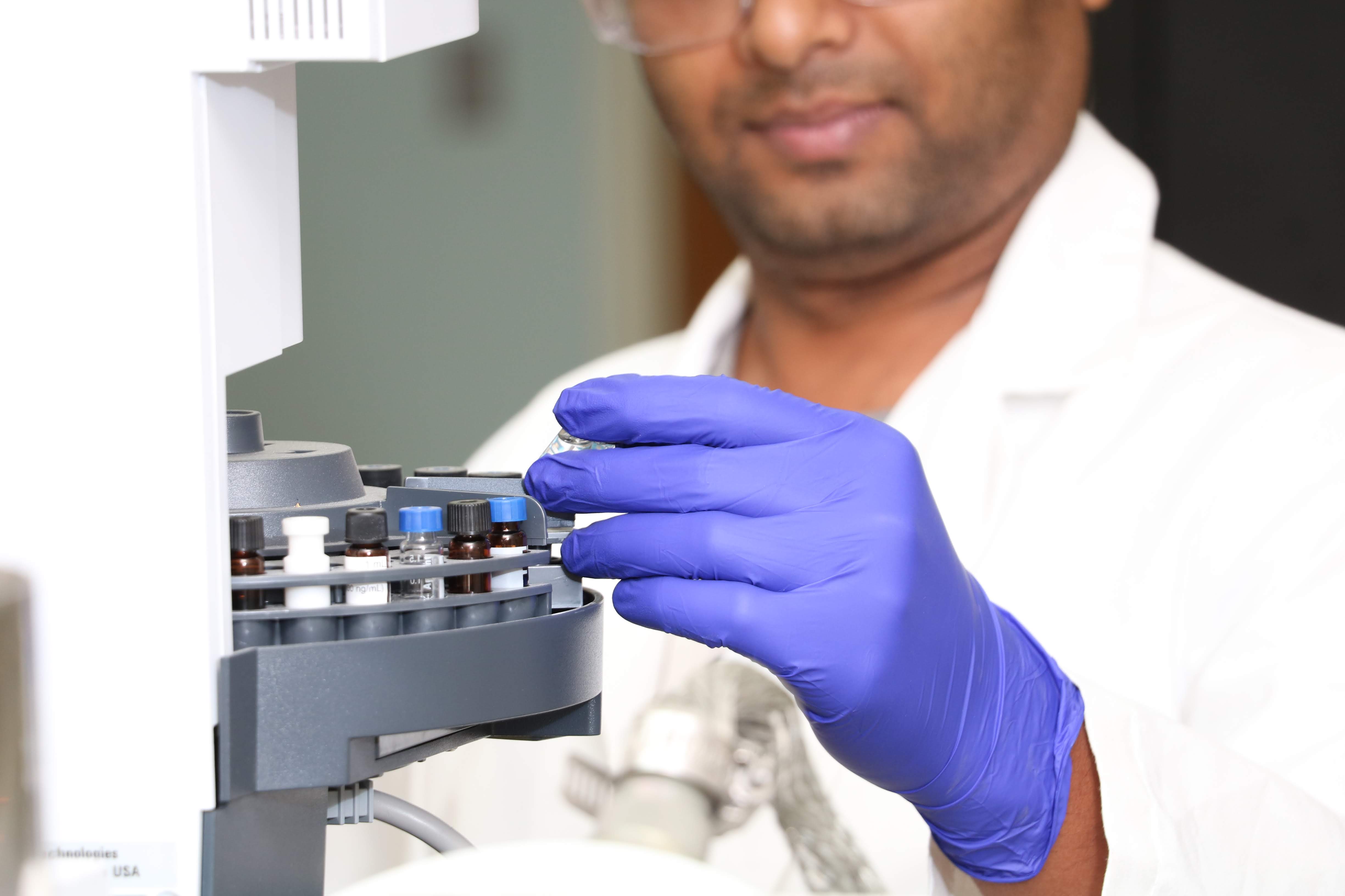 Technician preparing samples for analysis